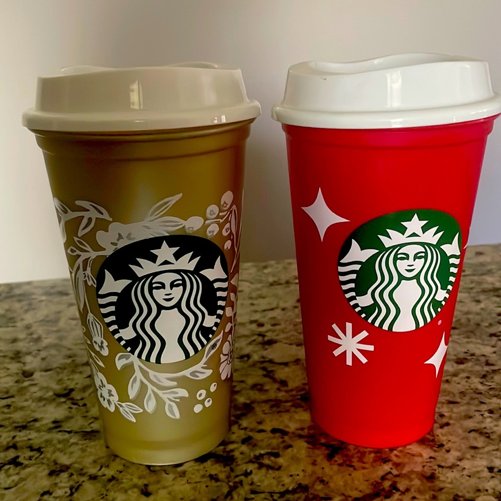 2 Starbucks cups with lids